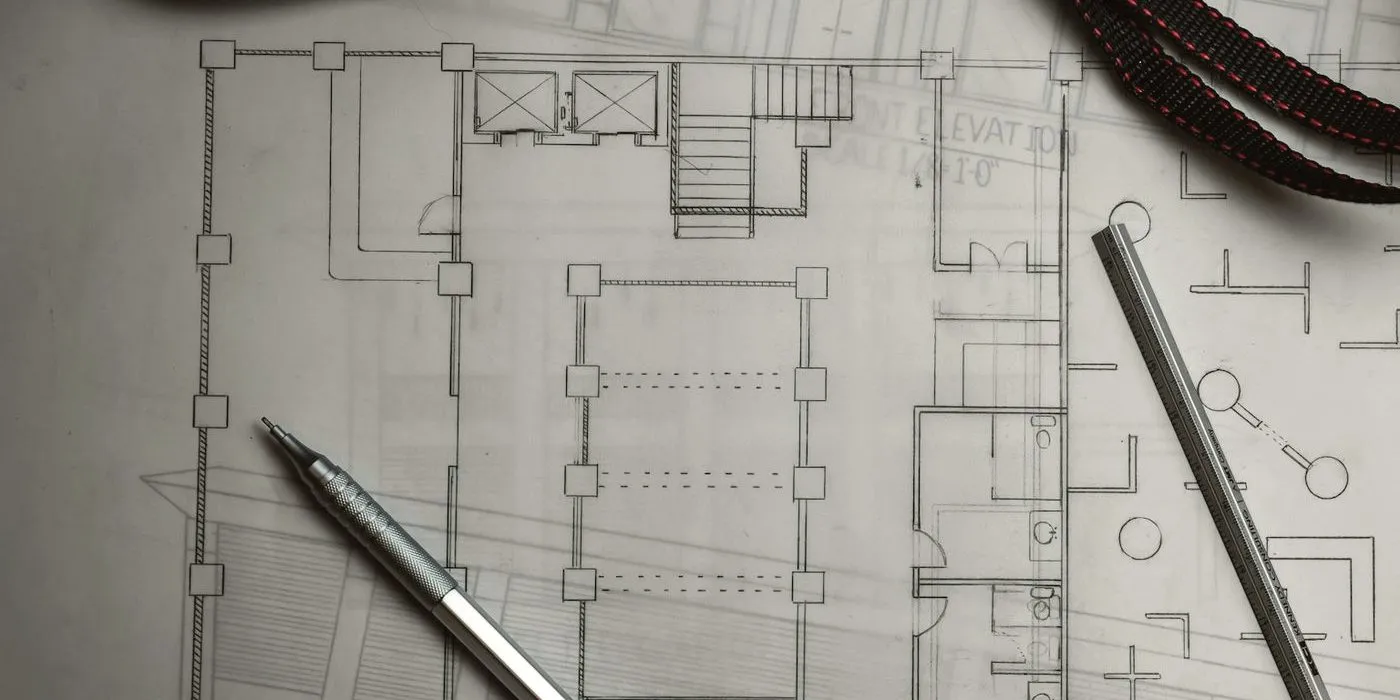 Pencil floor plan on tracing paper with a mechanical pencil and a scale ruler